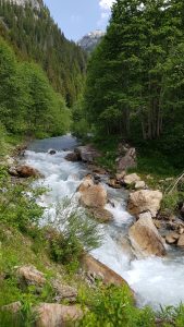 The raging river at the bottom of the valley