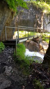 Bridge across the higher level of the waterfall
