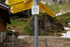 The hiking trail signpost at Alp Mädens
