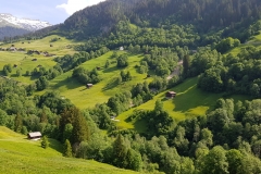 Looking down into the valley, with the mountains in the distance